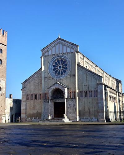 The Romanesque facade and bell tower of the Basilica di San Zeno, Verona