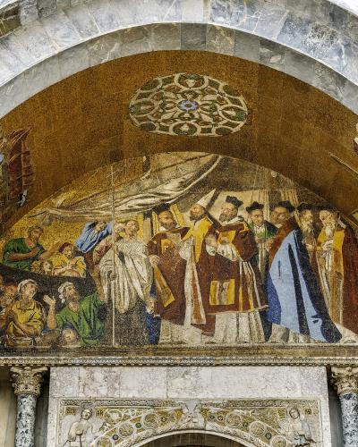 The image shows the Doge's Palace and the Campanile of St. Mark's Basilica in Venice, Italy, viewed from the water with boats in the foreground.