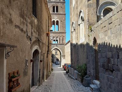 A medieval lane in Casertavecchia with its bell tower