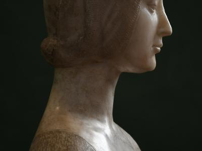 A close-up photograph of a deteriorated fresco depicting two women in profile wearing period headwear and jewelry, with visible cracking and pigment loss on the wall surface.