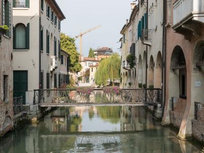 A canal lined with old houses in Treviso