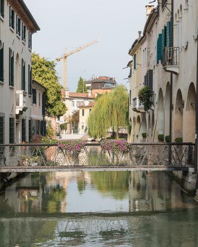 A canal lined with old houses in Treviso