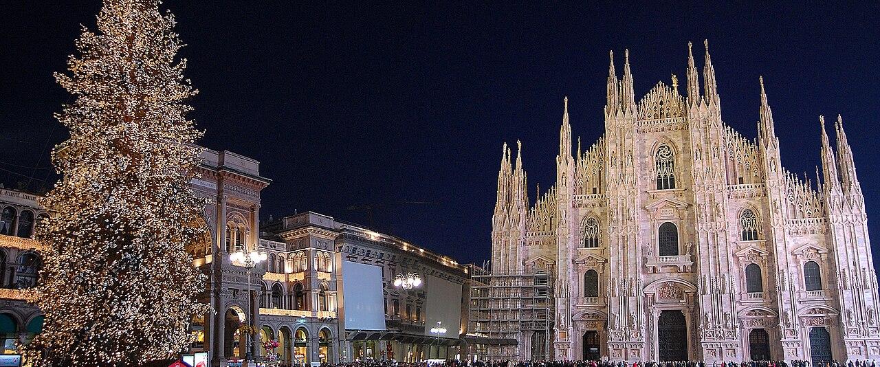 Piazza del Duomo in Milan at night with the Christmas tree and the lit cathedral facade