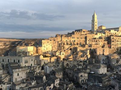 The Sassi di Matera and the cathedral bell tower in warm evening light