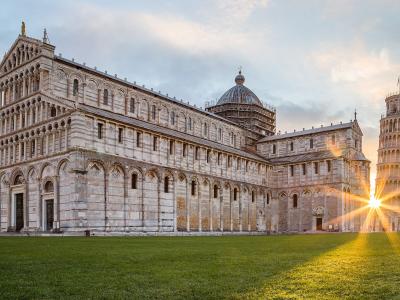 Pisa Cathedral and the Leaning Tower at sunrise on the Piazza dei Miracoli
