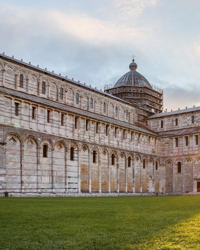 Pisa Cathedral and the Leaning Tower at sunrise on the Piazza dei Miracoli