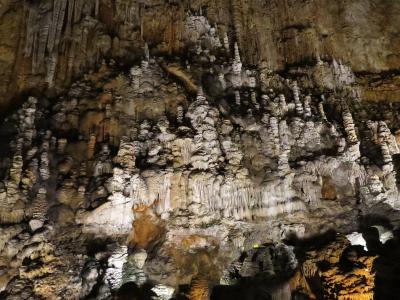 Stalactites and stalagmites in the great chamber of the Grotta Gigante