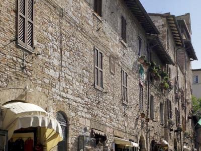 Medieval houses and shops along Via San Francesco in Assisi