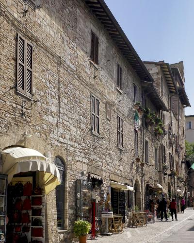 Medieval houses and shops along Via San Francesco in Assisi