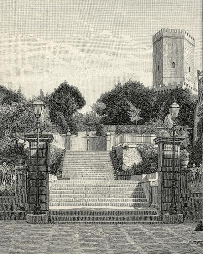 A 19th-century wood engraving depicting a stone staircase leading up to a fortified tower, flanked by trees and a building with a balcony on the right.