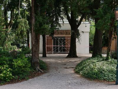 A tree-lined path to a pavilion in the Giardini della Biennale, Venice