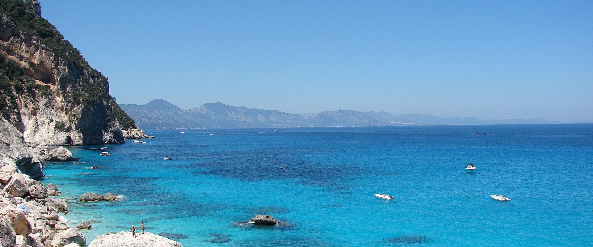 Turquoise water and white pebbles at Cala Goloritzè on the Gulf of Orosei, Sardinia