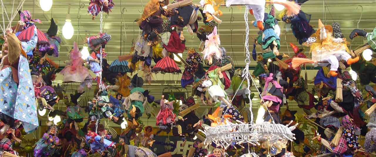 Befana dolls hanging at a Christmas stall in Piazza Navona, Rome