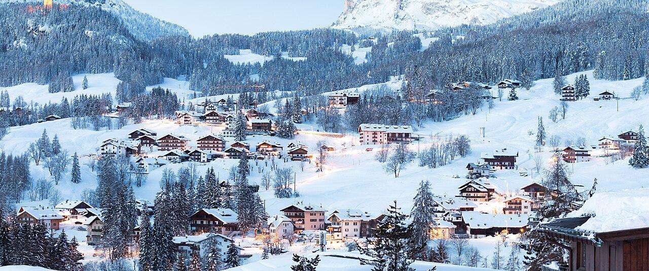 The hamlet of Ronco above Cortina d'Ampezzo under fresh snow at dusk