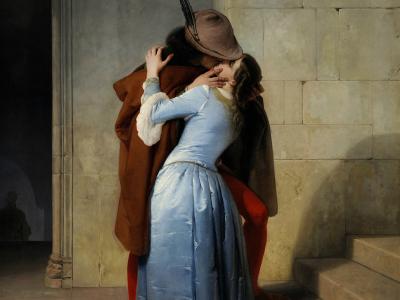 A painting depicting a man and woman embracing and kissing in a stone architectural setting, identified by the filename as "El Beso" (The Kiss) from 1859.