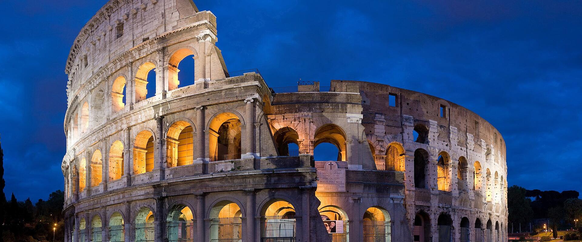 The Colosseum in Rome illuminated at dusk