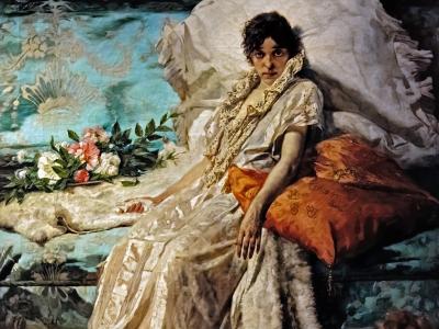 A painting of a woman in a white dress reclining on a chaise lounge with pillows and flowers, displayed within a museum setting.