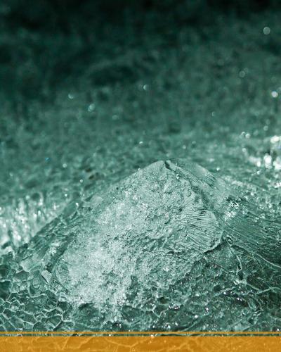 A close-up photograph of textured ice formations with a logo in the bottom right corner reading "etna walk" accompanied by a stylized mountain and sun graphic.
